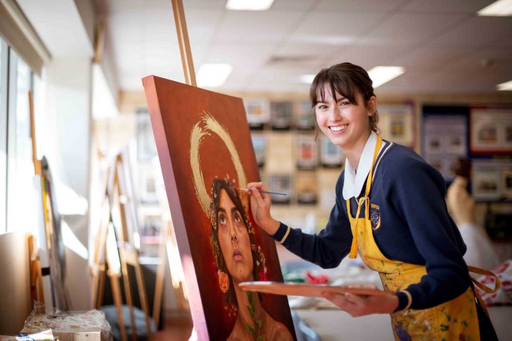 Senior School Art student painting self portrait